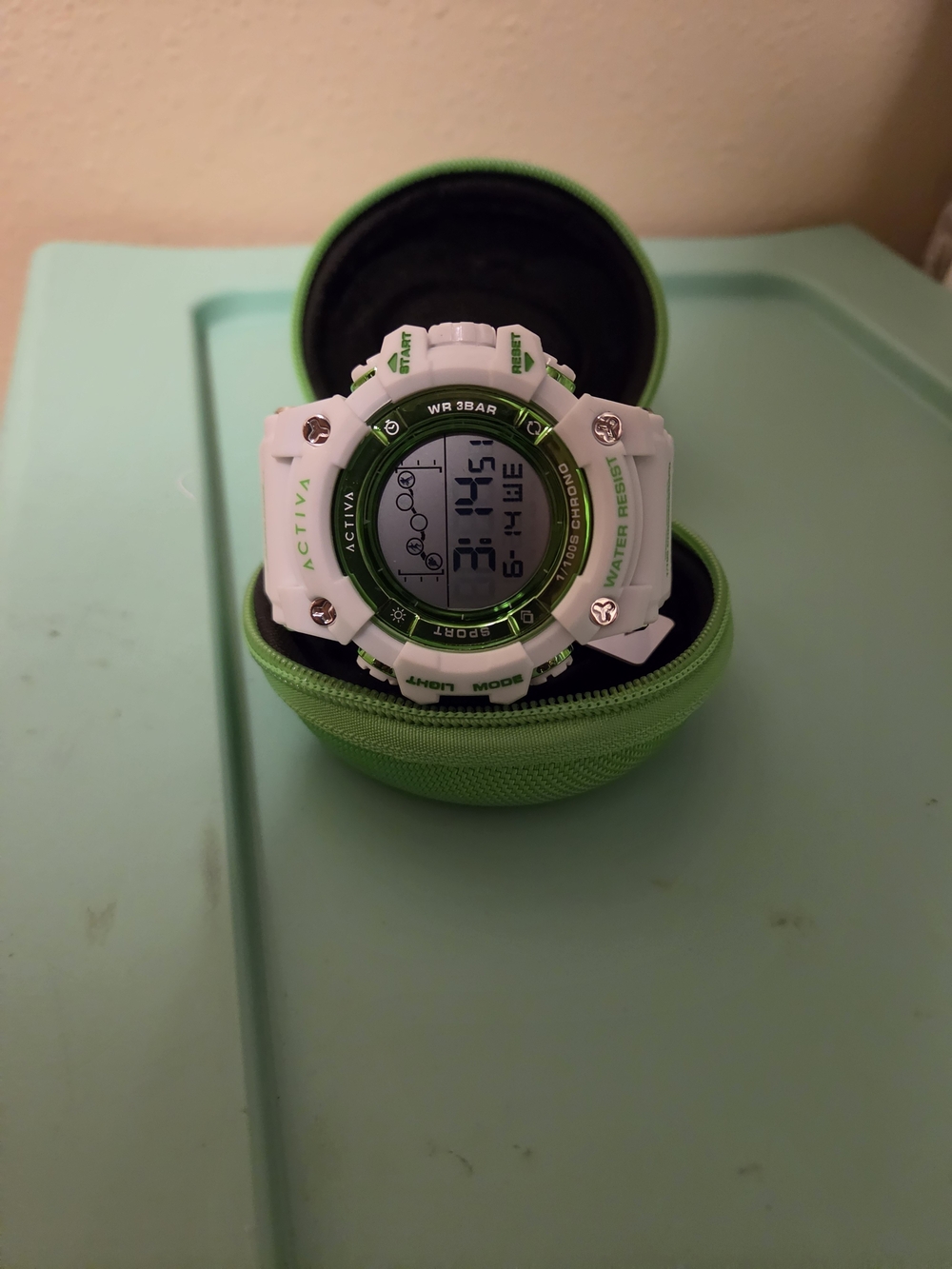 Ativa White and Green Sport Digital Watch with LCD with a matching Invicta Case